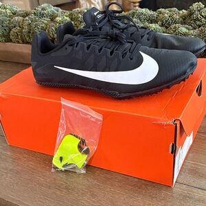 NWOT Nike Black track and field shoe with White Swoosh Men US 11.5